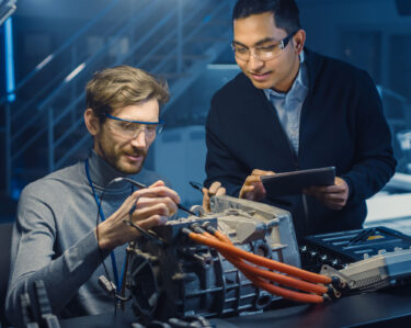 Engineer reviewing technical specifications for risk assessment.
