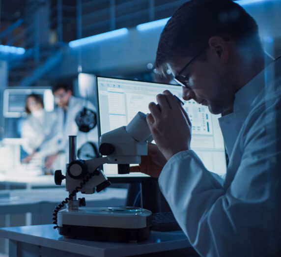 Engineer performing diagnostics on industrial control panel.