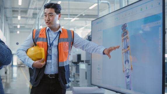 Engineer reviewing technical specifications for product innovation.