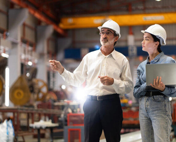 Technician advising on product validation testing