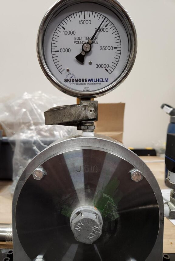 Skidmore-Wilhelm bolt tension measurement device with bolt installed, showing pretension in the joint.