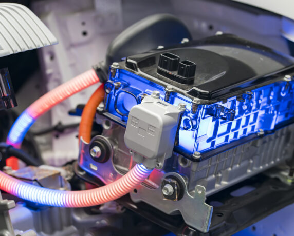 Industrial engineer inspecting machinery in a factory.