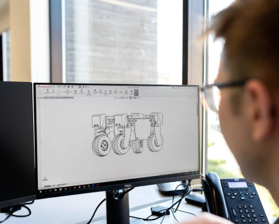 Engineer developing complex system architecture in a collaborative setting.