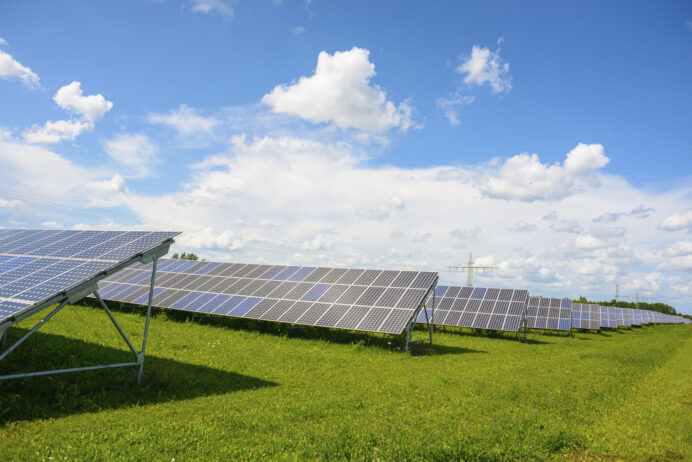  Array of solar panels angled towards the sun.