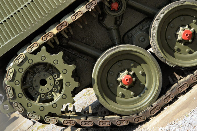 Heavy-duty tank wheels on rugged terrain.
